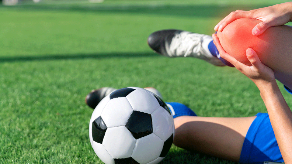 soccer player with injured knee